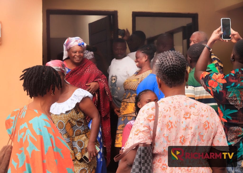 Residents gather near the newly commissioned public toilet facility.