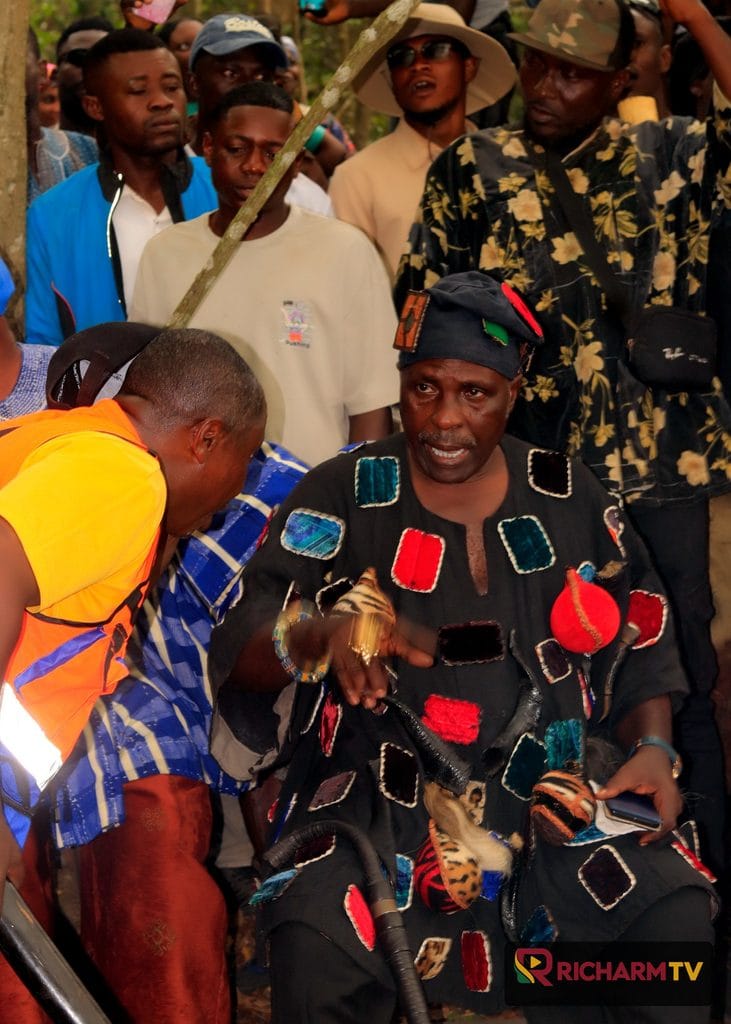 A participant in traditional attire during the festival visit.